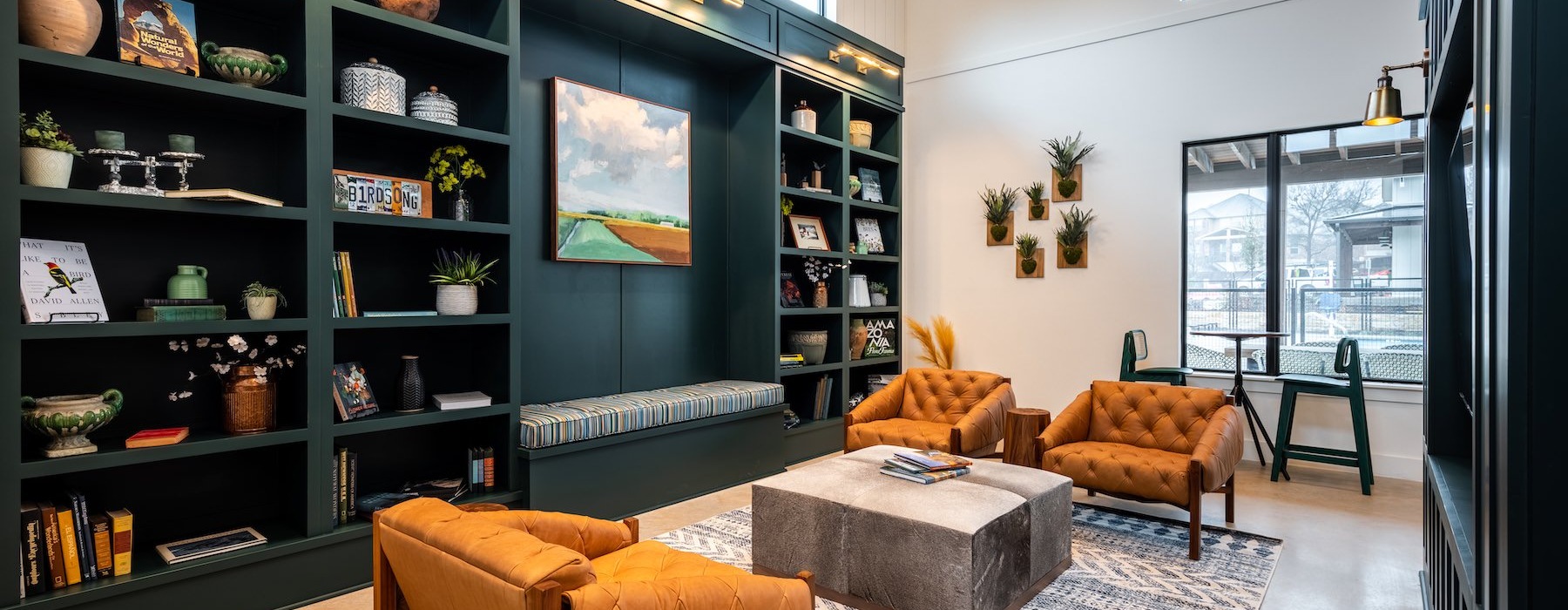 lounge with seating and bookshelves