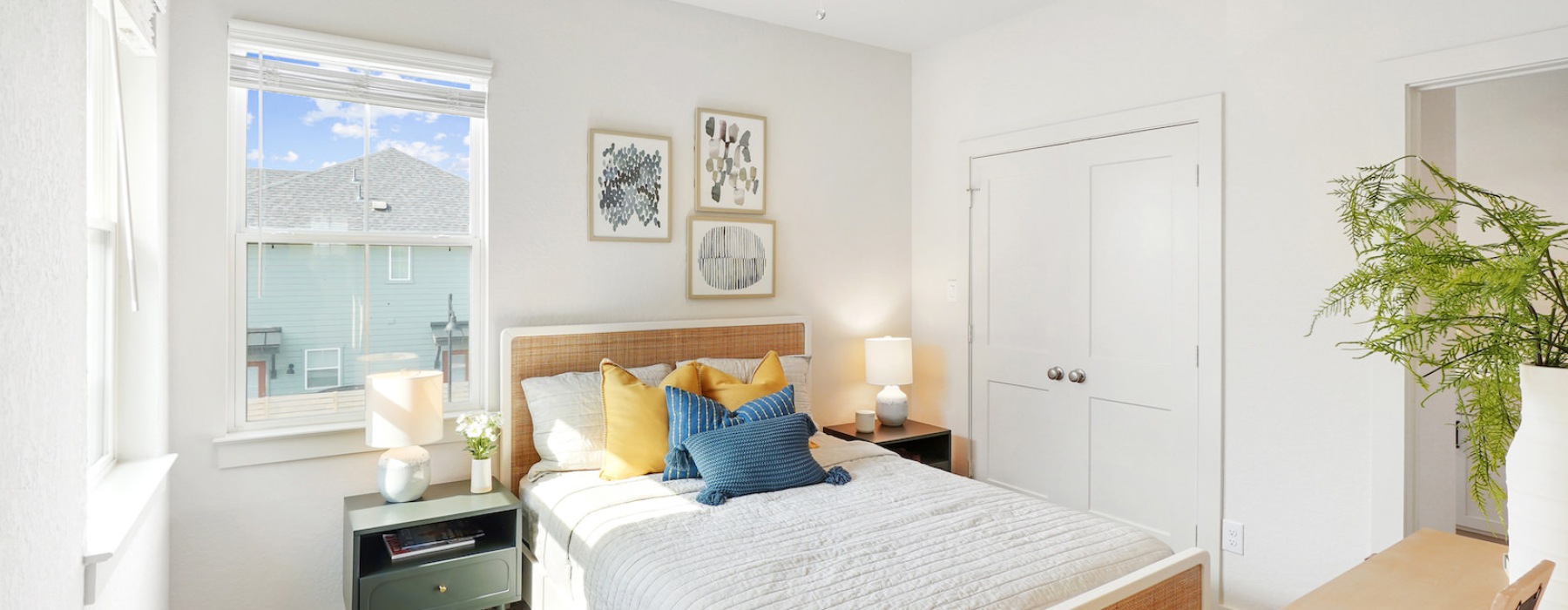 Cozy bedroom with natural light and simple furnishings